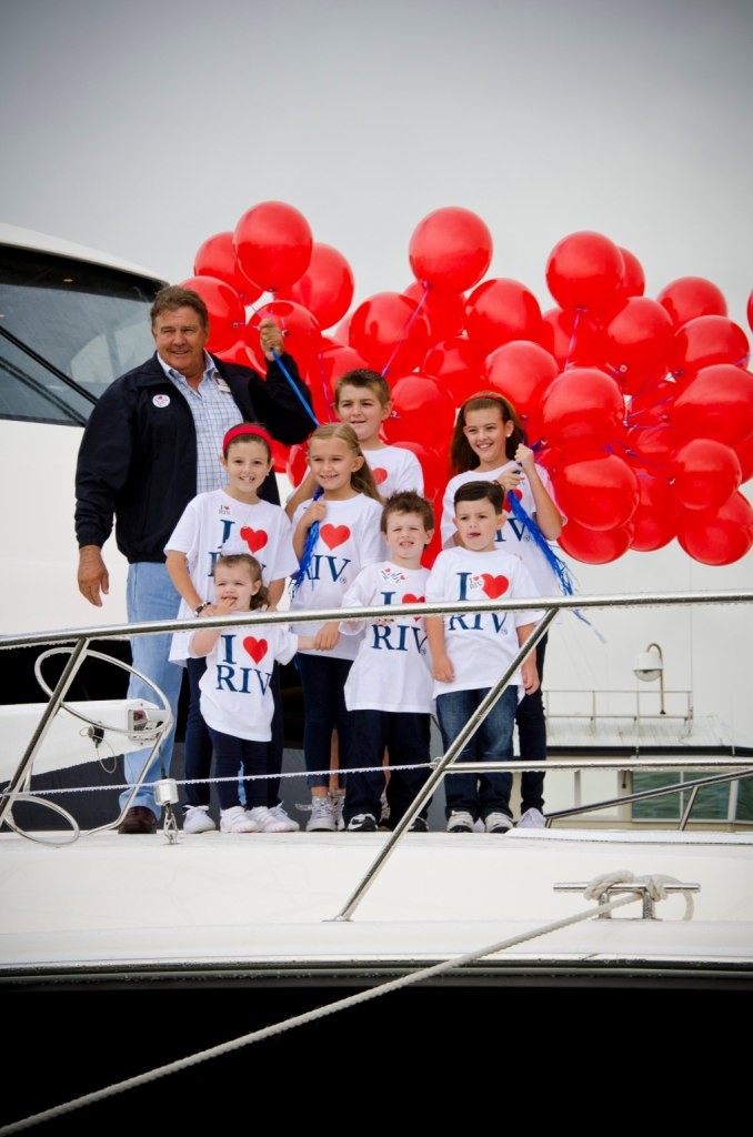 Riviera owner Dennis Hughes with his seven grandchildren on the bow of the 53 at the launch © Stephen Milne